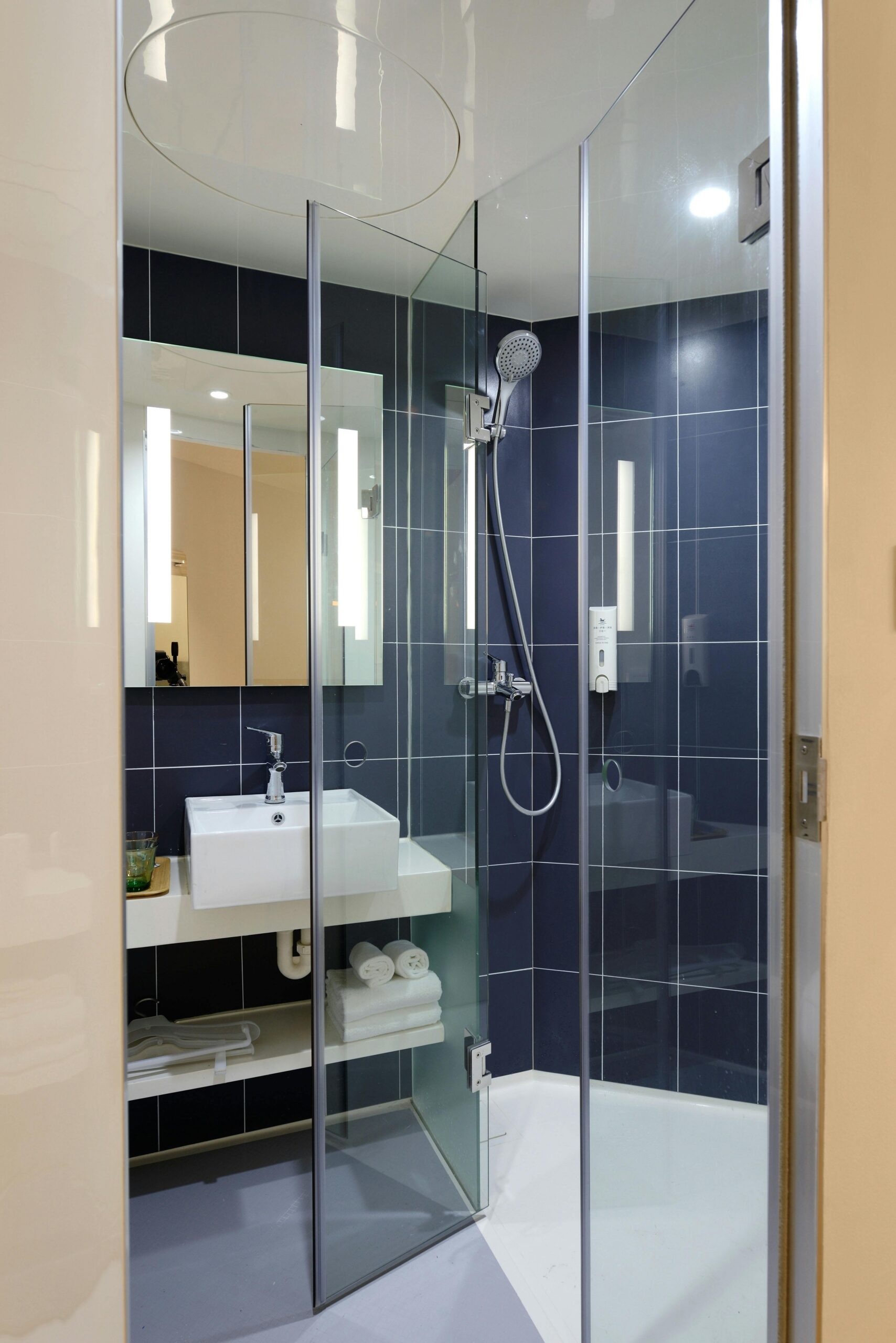 Sleek modern bathroom with a glass shower and contemporary design elements.